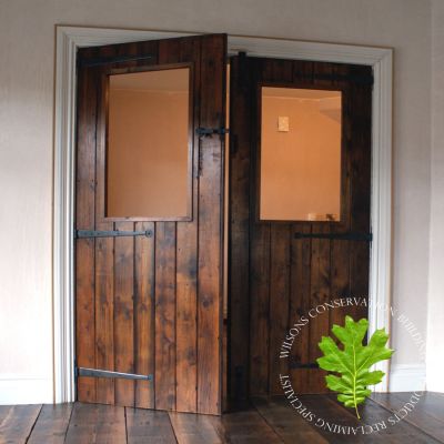 Pair of Guinness board double planked parlour doors
