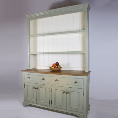 Green painted dresser fitted with brass handles