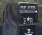 Black Royal Mail post box