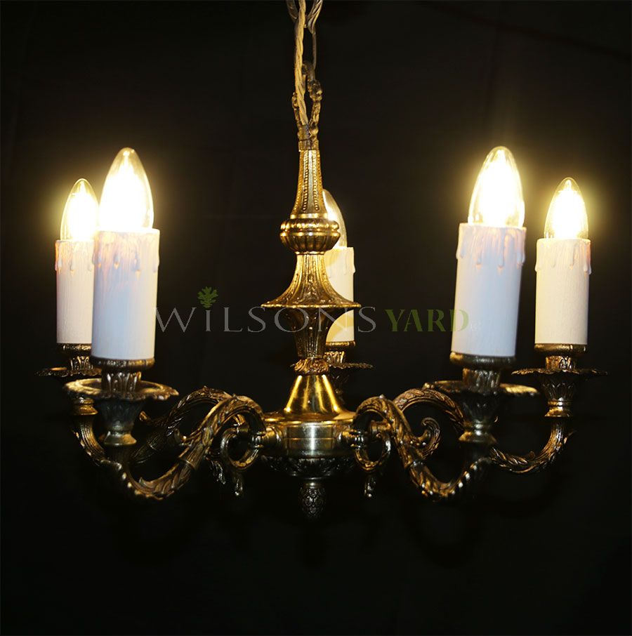 Vintage aged brass chandelier with 5 sweeping arms, supporting candles