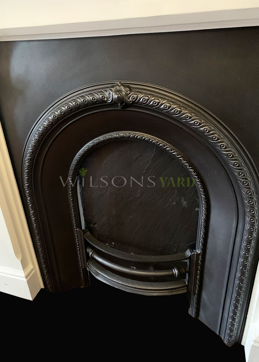 Restored Victorian cast iron fireplace