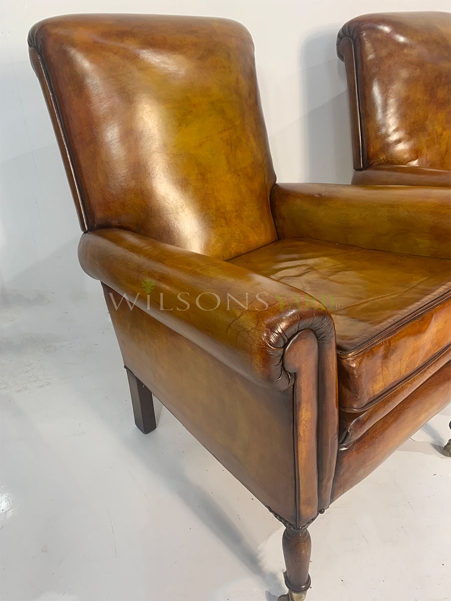 Pair of tan leather chairs