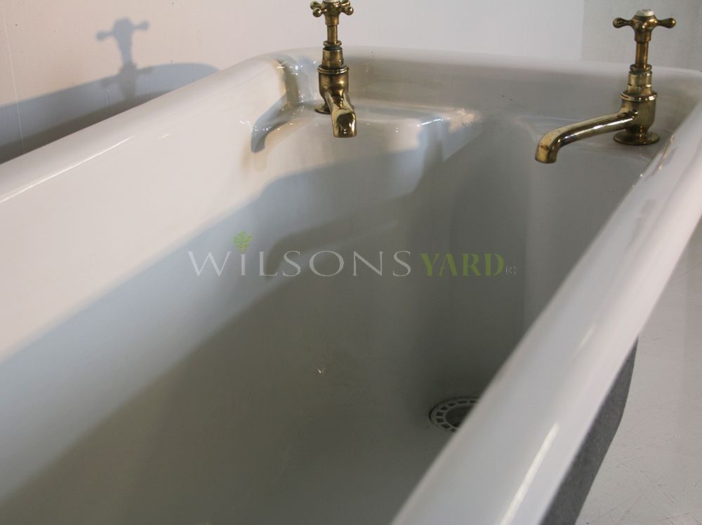 Original cast iron roll top bath with original taps