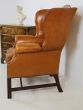 Antique leather wing back chair 