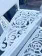 Original Victorian cast iron spiral staircase with intricate filigree treads