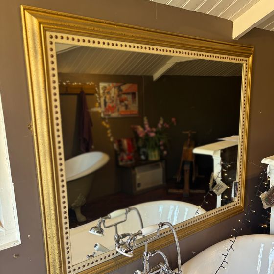 Stylish & studded gilt mirror