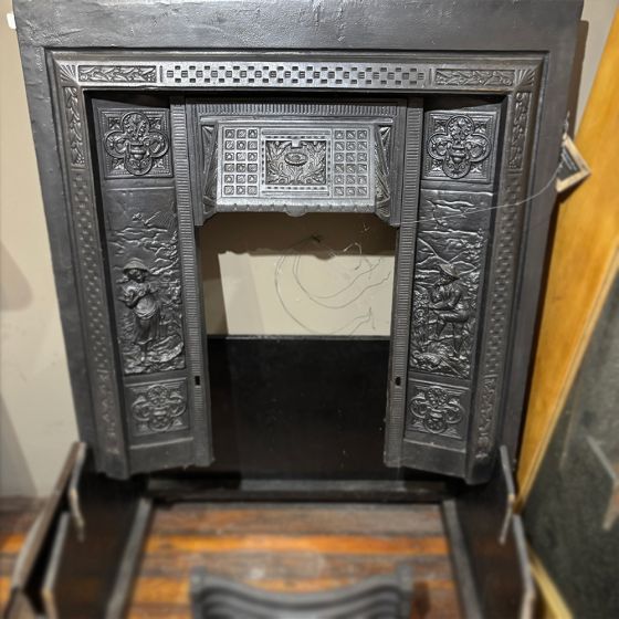 Cast iron insert with cast detailed panels