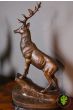 Pair of Bronze Reposing Stags on Mantle Plinths