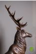 Pair of Bronze Reposing Stags on Mantle Plinths