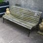 Antique wooden garden bench in aged Oak