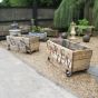 Vintage wooden garden planters on wheels