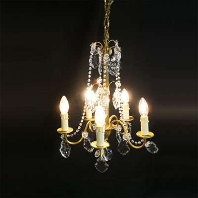 Brass and crystal chandelier supporting 5 candles