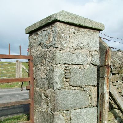 Pair of original Irish Granite pillars with caps