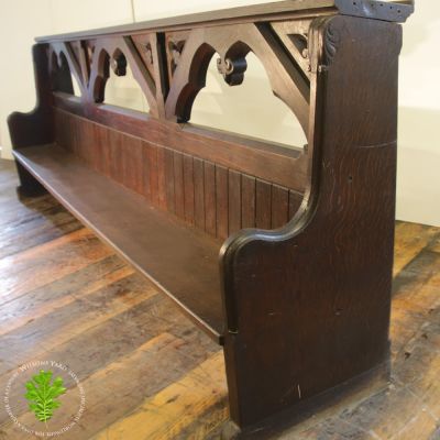 One of 2 19th century high back gothic church pews