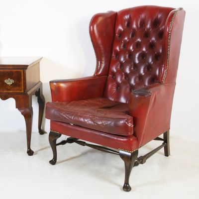 Antique button back leather chair 