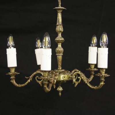 Vintage brass chandelier with ornate detailing 
