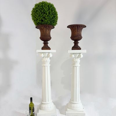 Beautiful pair of vintage cast iron urns on columns 