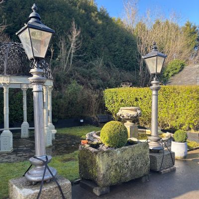Pair of Victorian fluted, cast iron column lights on granite plinths