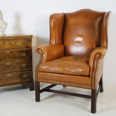 Dark tan leather wing back chair 