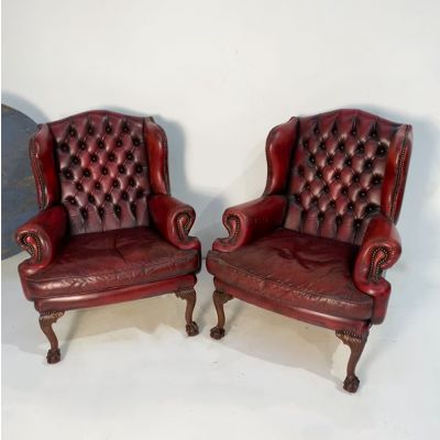 Pair of red leather button back chairs 