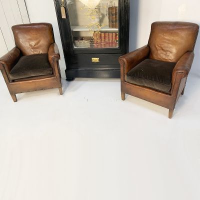 Pair of vintage French leather salon chairs 