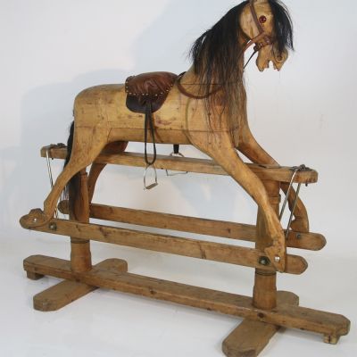 Antique rocking horse beautifully carved in wood