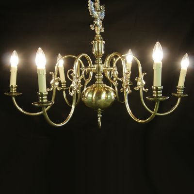Restored pair of brass chandeliers with 6 looping arms