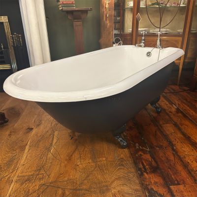 Restored Edwardian cast iron roll top bath