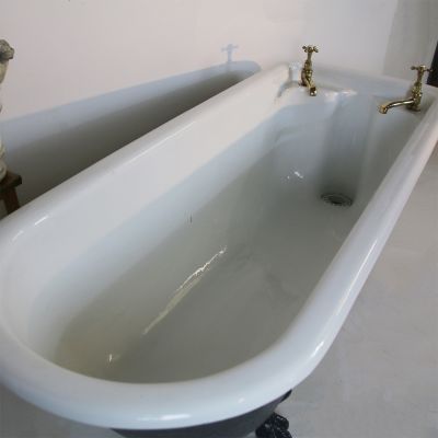 Original cast iron roll top bath with original taps