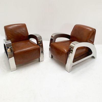 Designer retro leather armchairs with polished alloy arms