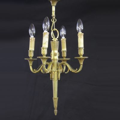 Brass chandelier with decorative base 