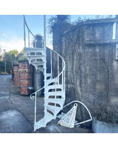 Original Victorian cast iron spiral staircase with intricate filigree treads