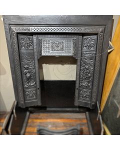 Cast iron insert with cast detailed panels