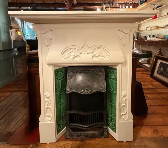 Restored 19th century Art Nouveau cast iron fireplace 