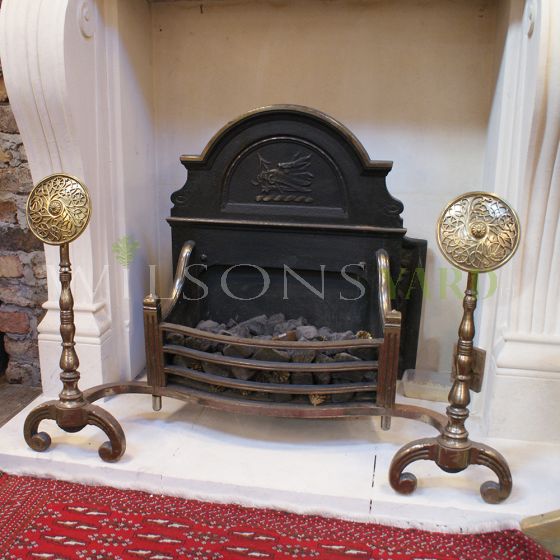 Antique fire grate with brass detailing 