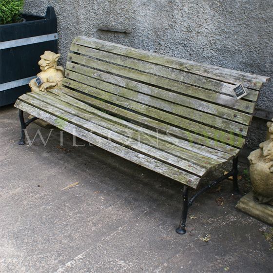 Antique wooden garden bench in aged Oak