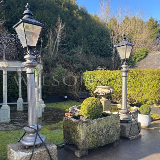 Pair of Victorian fluted, cast iron column lights on granite plinths
