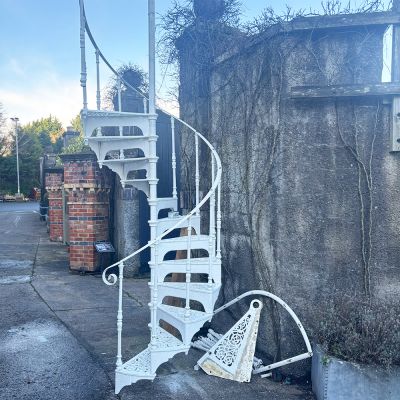 Original Victorian cast iron spiral staircase with intricate filigree treads