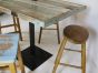 Vintage distressed café table with old stools 